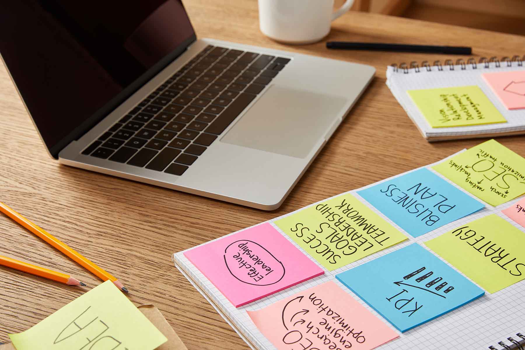 paper-stickers-with-business-strategy-and-laptop-o-KGQHWUL.jpg